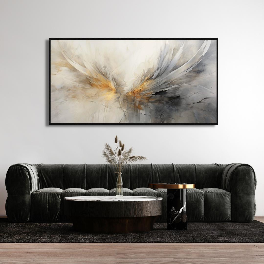Abstract art piece on a wall above a gray sofa in a living room setting.