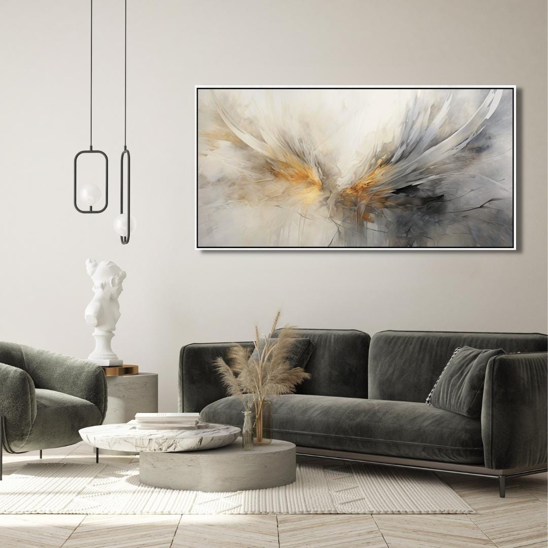 Modern living room with a gray sofa, abstract painting, and decorative items.